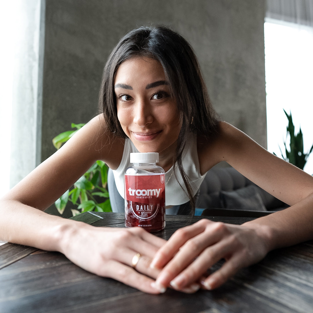 Daily - 14 Mushroom Blend - Strawberry Mango - Holistic Blend - Woman Smiling with Gummies - Troomy Nootropics in Whittier, CA