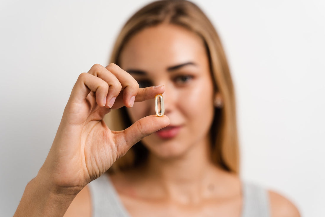 Shine - Tremella and Biotin - White Peach Pomegranate - Beauty Support - Woman Holding Capsule- Troomy Nootropics in Whittier, CA