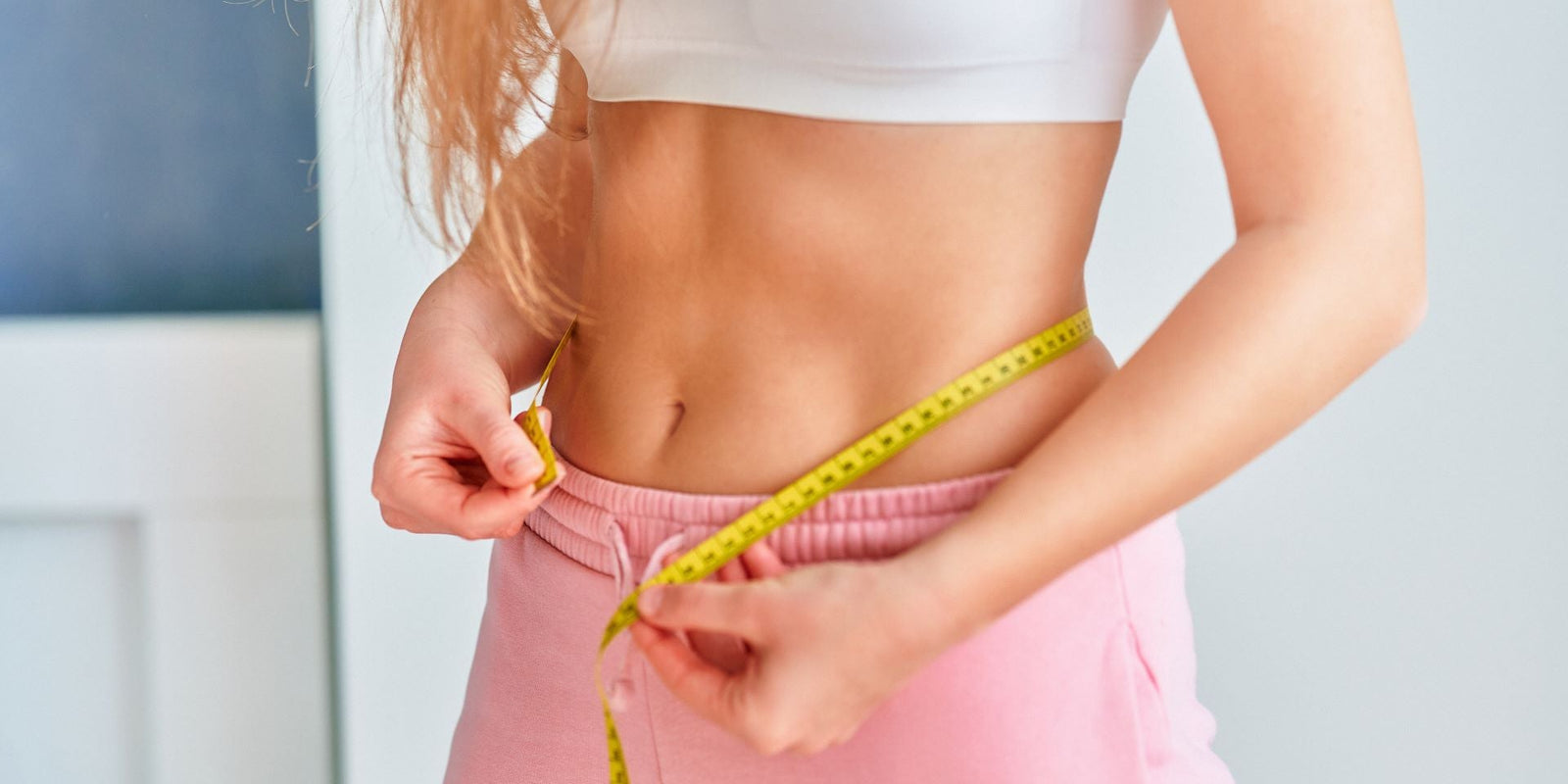 Weight Loss -Woman Measuring Waist - Functional Mushrooms  - Health benefits - Holistic Wellness  - Troomy Nootropics in Whittier, CA