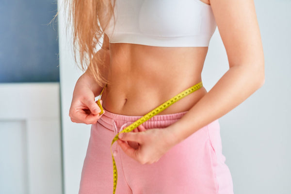 Weight Loss -Woman Measuring Waist - Functional Mushrooms  - Health benefits - Holistic Wellness  - Troomy Nootropics in Whittier, CA