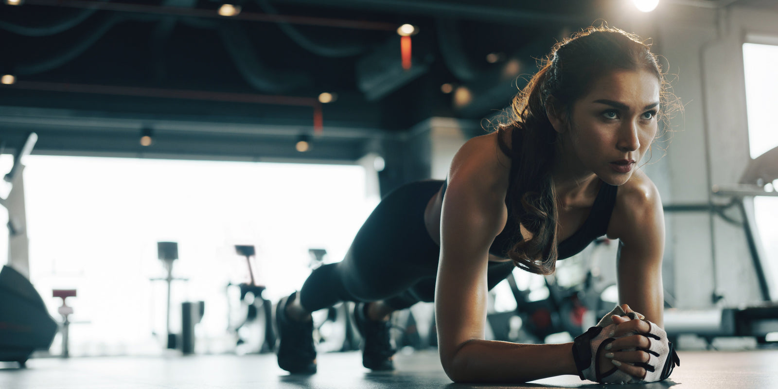Woman Does Plank Workout in Gym - Functional Mushrooms  - Troomy Nootropics in Whittier, CA