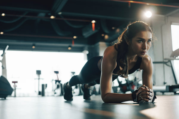 Woman Does Plank Workout in Gym - Functional Mushrooms  - Troomy Nootropics in Whittier, CA