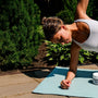Recovery - Reishi and Ashwagandha - Berry Acai - Muscle Recovery - Woman Doing Yoga on Mat Next to Gummy Jar - Troomy Nootropics in Whittier, CA