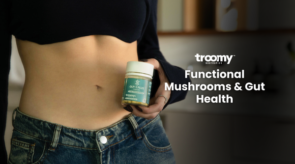 woman holding glp1 capsules weight loss management pills next to toned stomach