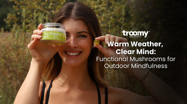 woman holding functional mushroom gummy for energy