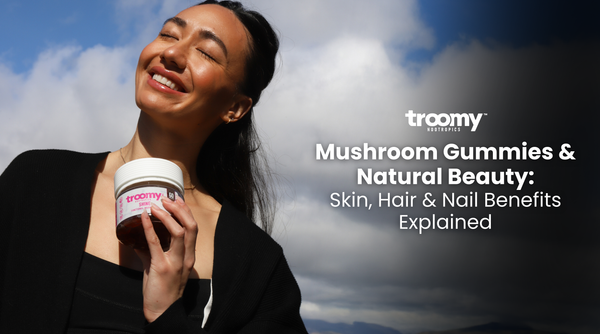 woman holding collagen gummies with smooth shiny skin