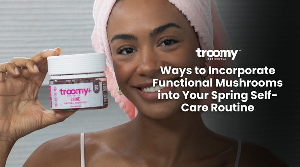 woman taking collagen in a pink bath towel